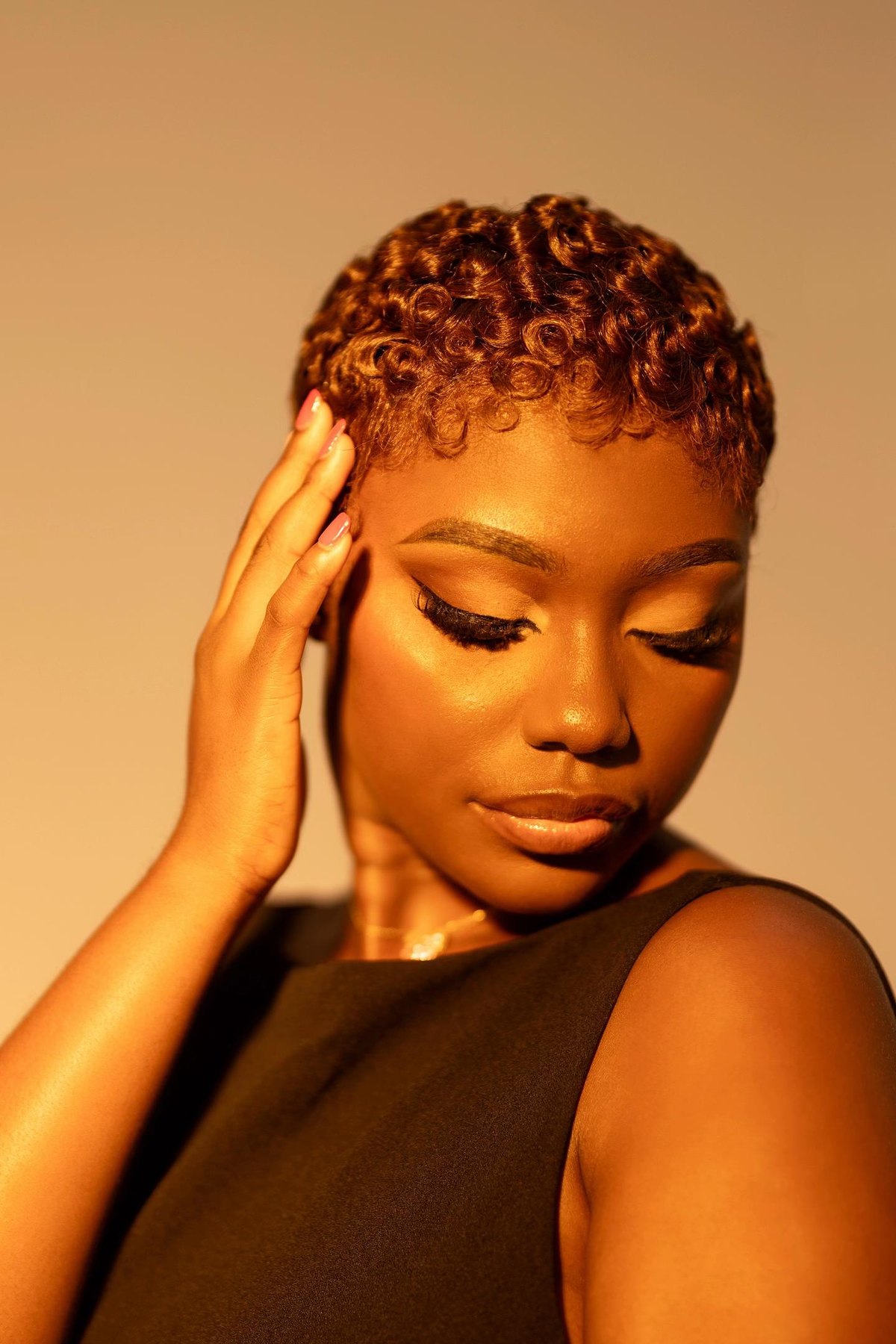 Christabel's copper curls in golden light